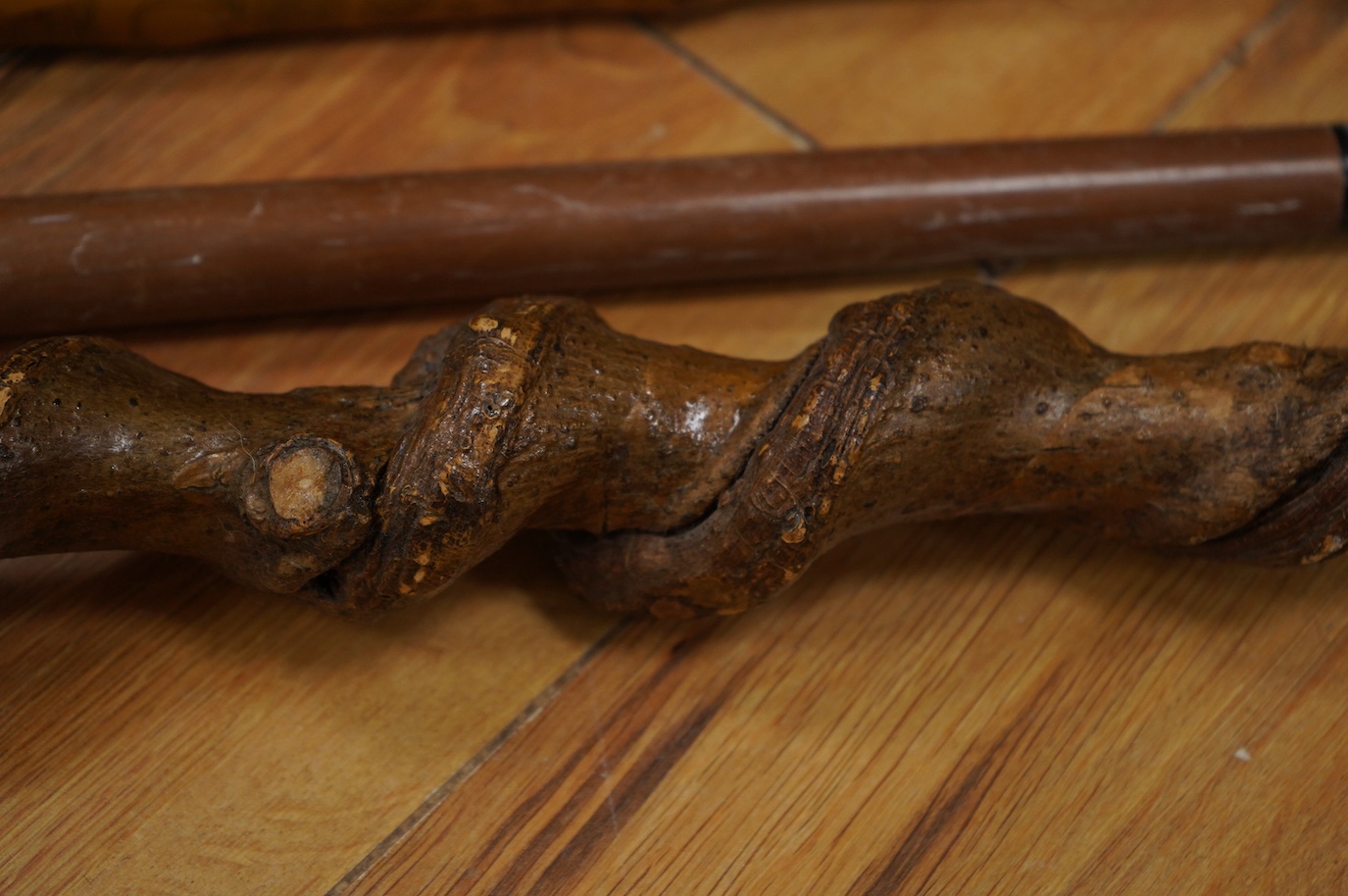 Three novelty walking sticks and gouged gathering bowl. Condition - fair